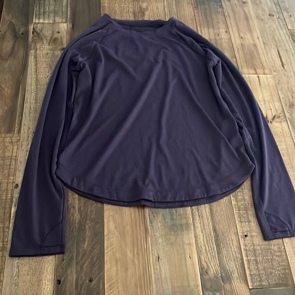 This is a purple long sleeve shirt from Athleta Girl. Size L/12